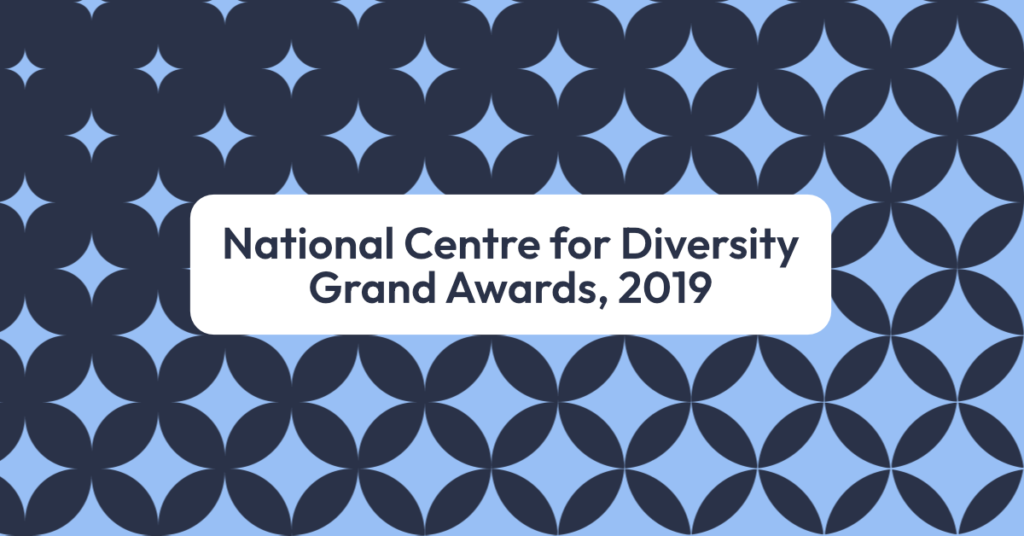 A geometric star pattern overlaid by text that reads 'National Centre for Diversity Grand Awards, 2019'